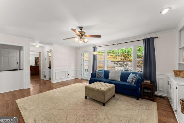 4223 N Mountain Rd NE, Marietta, GA 30066 - living area with ceiling fan, a decorative wall, wainscoting, ornamental molding, and stairway