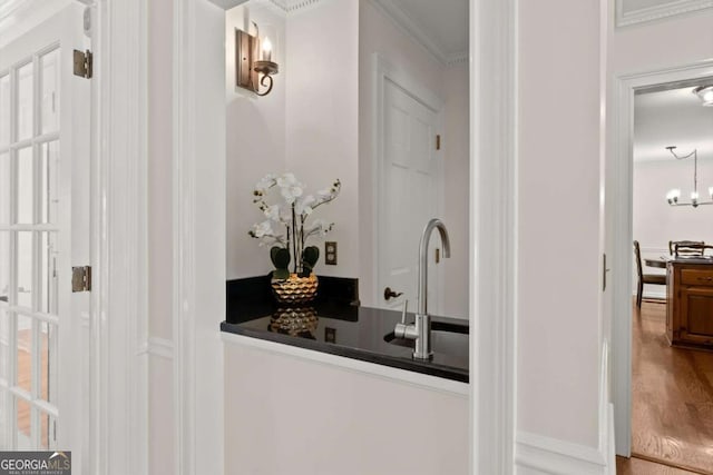 4223 N Mountain Rd NE, Marietta, GA 30066 - bar area with a sink, ornamental molding, and wood finished floors