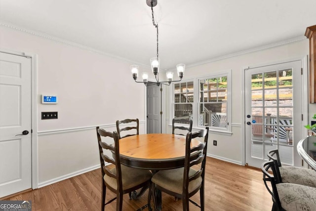 4223 N Mountain Rd NE, Marietta, GA 30066 - dining room featuring ornamental molding, a chandelier, light wood-style flooring, and baseboards