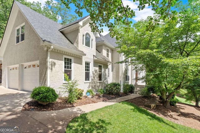4223 N Mountain Rd NE, Marietta, GA 30066 - view of front of property featuring concrete driveway, an attached garage, a shingled roof, and stucco siding