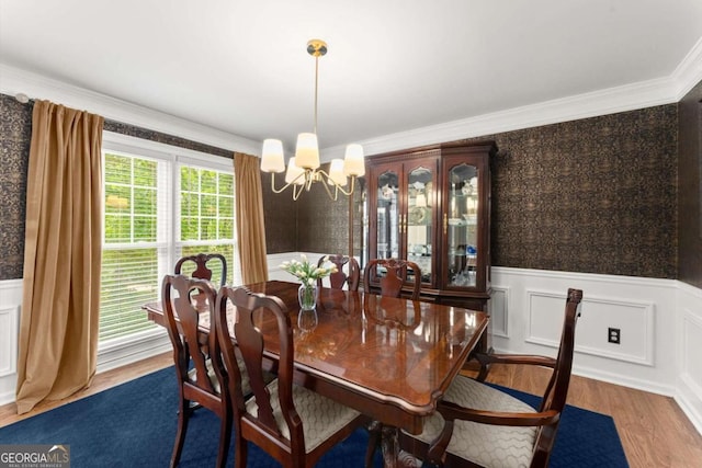 4223 N Mountain Rd NE, Marietta, GA 30066 - dining space featuring a chandelier, wood finished floors, wainscoting, and ornamental molding