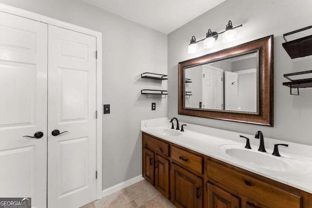 4223 N Mountain Rd NE, Marietta, GA 30066 - bathroom featuring double vanity and baseboards