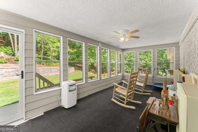 4223 N Mountain Rd NE, Marietta, GA 30066 - sunroom featuring a ceiling fan, plenty of natural light, carpet flooring, and a textured ceiling