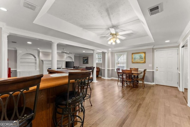 4223 N Mountain Rd NE, Marietta, GA 30066 - indoor dry bar with ornate columns, a ceiling fan, a tray ceiling, light wood-type flooring, and recessed lighting