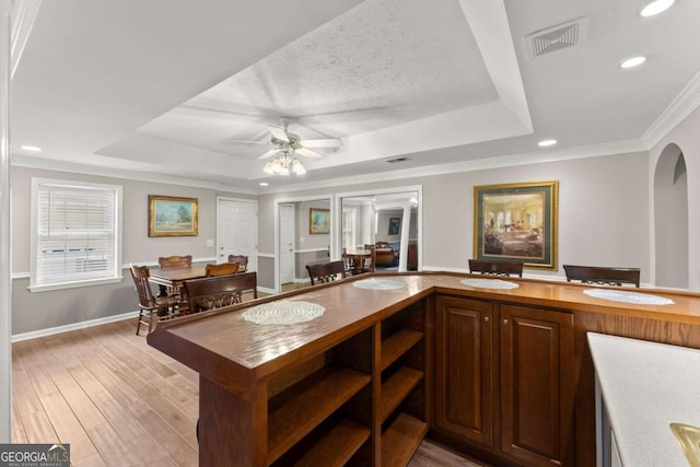 4223 N Mountain Rd NE, Marietta, GA 30066 - kitchen featuring a raised ceiling, a ceiling fan, recessed lighting, light wood finished floors, and crown molding