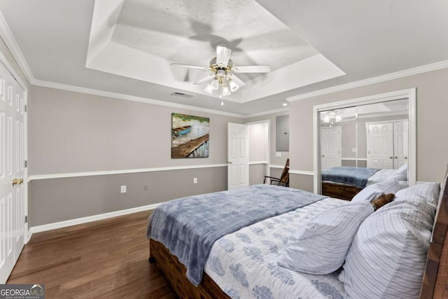 4223 N Mountain Rd NE, Marietta, GA 30066 - bedroom featuring a tray ceiling, wood finished floors, baseboards, ornamental molding, and a ceiling fan