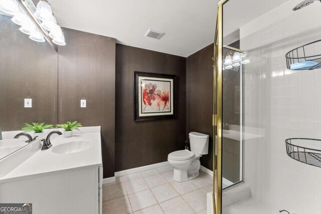 4223 N Mountain Rd NE, Marietta, GA 30066 - bathroom featuring vanity, toilet, a shower stall, baseboards, and tile patterned flooring