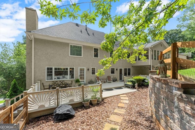 4223 N Mountain Rd NE, Marietta, GA 30066 - rear view of property with a wooden deck, a chimney, stucco siding, a shingled roof, and a patio area