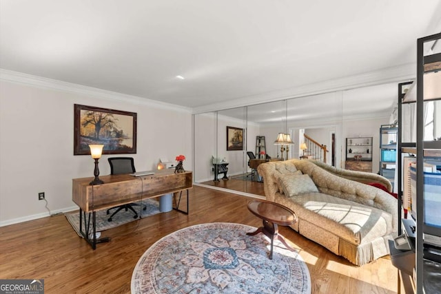 4223 N Mountain Rd NE, Marietta, GA 30066 - living room with wood finished floors, a desk, baseboards, and crown molding