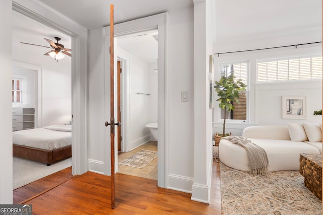653 N Highland Ave NE Unit 5, Atlanta, GA 30306 - bedroom with wood finished floors and ensuite bath