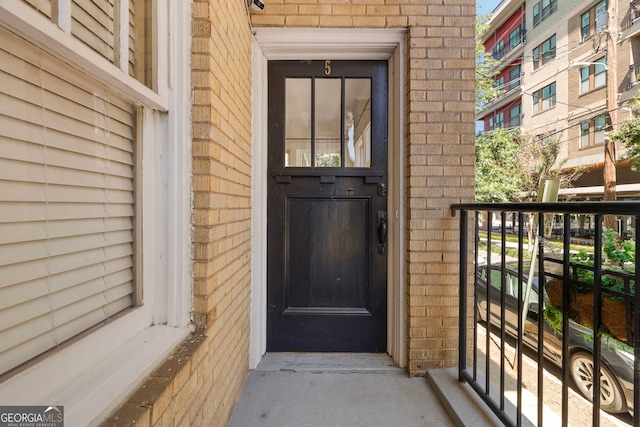 653 N Highland Ave NE Unit 5, Atlanta, GA 30306 - doorway to property featuring brick siding