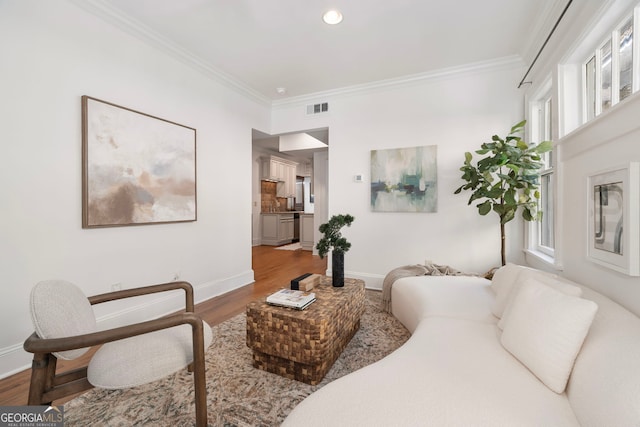 653 N Highland Ave NE Unit 5, Atlanta, GA 30306 - living room with crown molding, wood finished floors, plenty of natural light, and recessed lighting