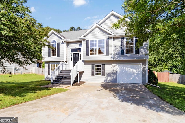7186 Raintree Loop, Jonesboro, GA 30236 - split foyer home featuring a garage and driveway