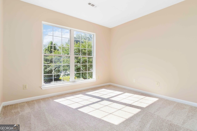 7186 Raintree Loop, Jonesboro, GA 30236 - carpeted empty room featuring baseboards and healthy amount of natural light