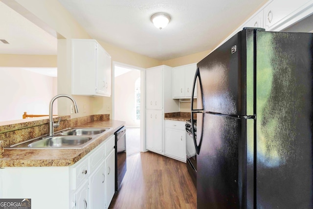 7186 Raintree Loop, Jonesboro, GA 30236 - kitchen with black appliances, a sink, dark wood finished floors, and white cabinetry