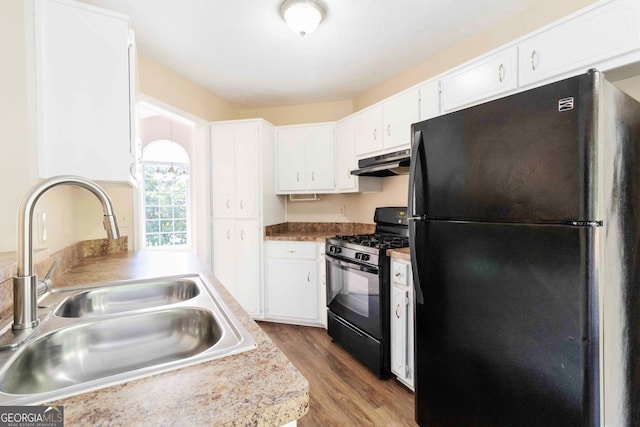 7186 Raintree Loop, Jonesboro, GA 30236 - kitchen featuring black appliances, a sink, under cabinet range hood, wood finished floors, and white cabinets