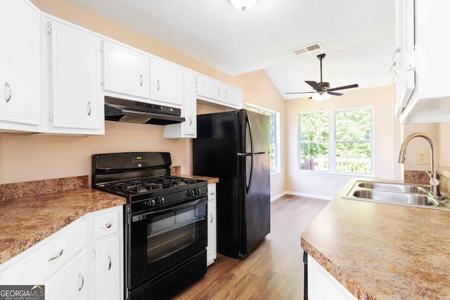 7186 Raintree Loop, Jonesboro, GA 30236 - kitchen with black appliances, under cabinet range hood, a sink, wood finished floors, and a ceiling fan