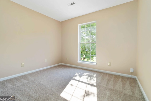 7186 Raintree Loop, Jonesboro, GA 30236 - carpeted empty room with baseboards