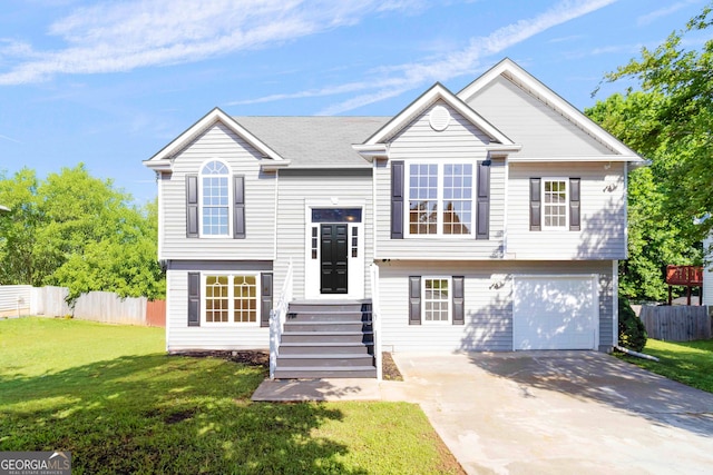 7186 Raintree Loop, Jonesboro, GA 30236 - raised ranch with concrete driveway and a garage