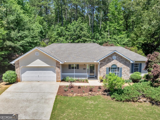 264 Keller Dr, Mcdonough, GA 30252 - ranch-style house with covered porch, concrete driveway, a garage, brick siding, and a shingled roof