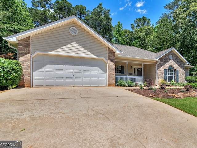 264 Keller Dr, Mcdonough, GA 30252 - ranch-style home with a porch, brick siding, concrete driveway, and an attached garage