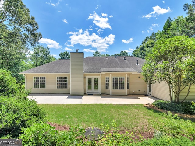 264 Keller Dr, Mcdonough, GA 30252 - back of property with a patio, a chimney, a lawn, and french doors