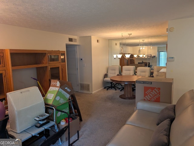 206 River Run, Atlanta, GA 30350 - living area featuring carpet flooring, a textured ceiling, and a chandelier