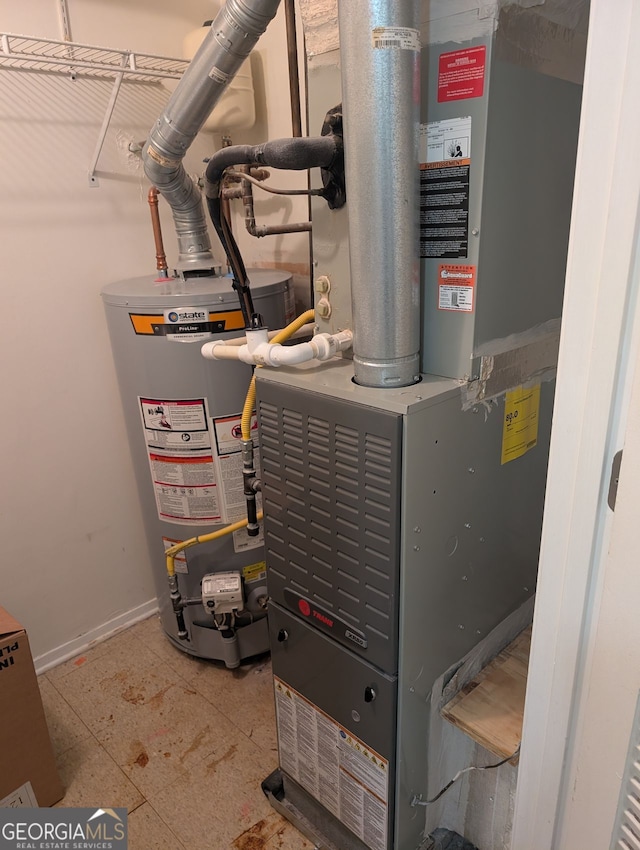 206 River Run, Atlanta, GA 30350 - utility room with gas water heater and heating unit
