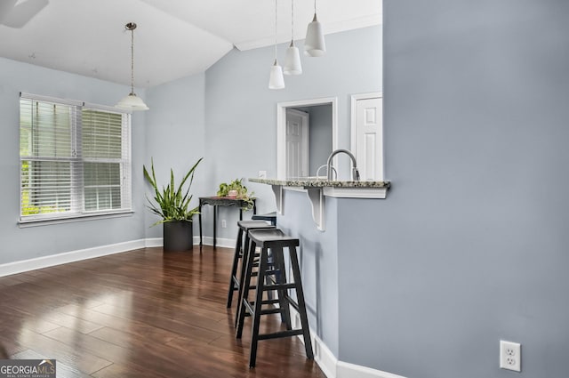 326 Daniel Trent Way, Kingsland, GA 31548 - dining area with lofted ceiling, baseboards, and dark wood finished floors