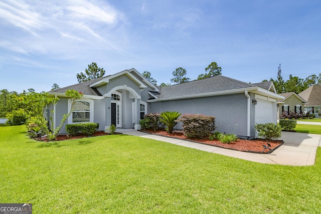 326 Daniel Trent Way, Kingsland, GA 31548 - ranch-style house featuring stucco siding, a garage, concrete driveway, and a front lawn