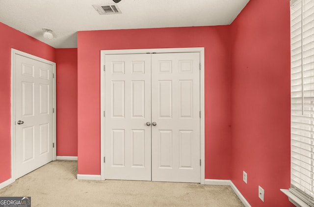 326 Daniel Trent Way, Kingsland, GA 31548 - unfurnished bedroom featuring light carpet, a closet, and baseboards
