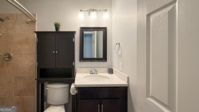 326 Daniel Trent Way, Kingsland, GA 31548 - bathroom with vanity, toilet, and a tile shower