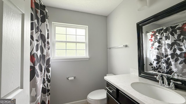 326 Daniel Trent Way, Kingsland, GA 31548 - full bathroom with vanity, toilet, a textured ceiling, baseboards, and a shower with shower curtain