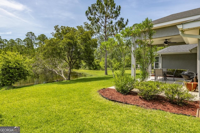 326 Daniel Trent Way, Kingsland, GA 31548 - view of green lawn with a ceiling fan and a patio area