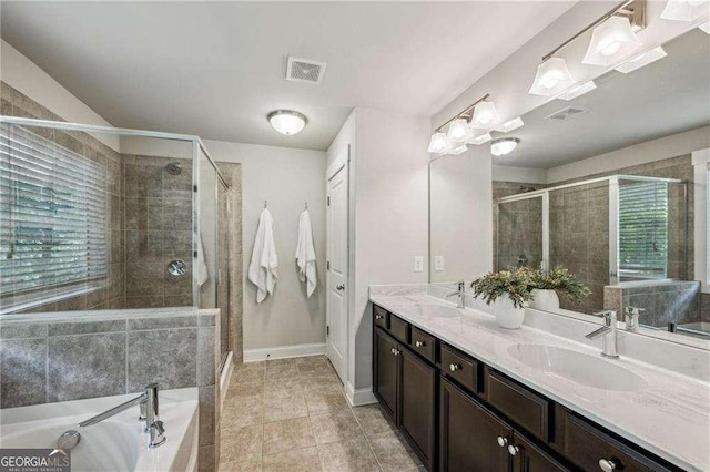 2817 White Oak Ln, Decatur, GA 30032 - bathroom with a stall shower, a bath, double vanity, and baseboards