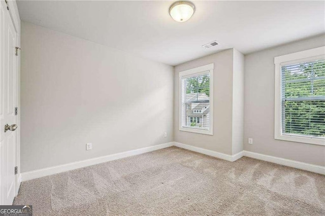 2817 White Oak Ln, Decatur, GA 30032 - carpeted empty room with baseboards