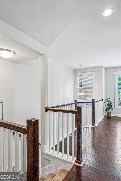 2817 White Oak Ln, Decatur, GA 30032 - hallway with an upstairs landing, wood-type flooring, a chandelier, baseboards, and recessed lighting