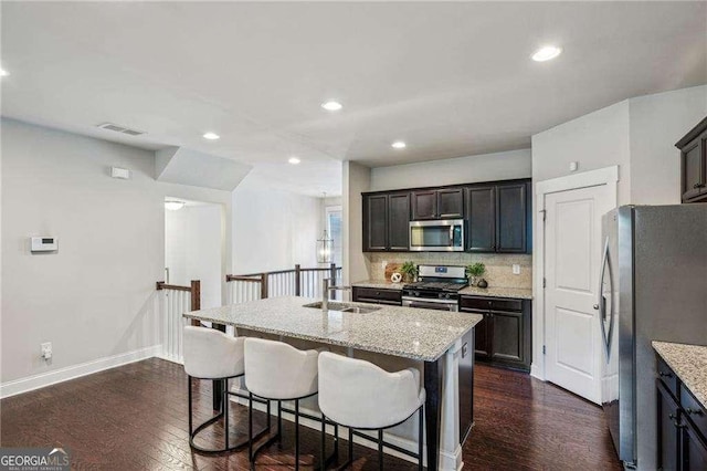 2817 White Oak Ln, Decatur, GA 30032 - kitchen with stainless steel appliances, a sink, baseboards, dark wood-style floors, and recessed lighting