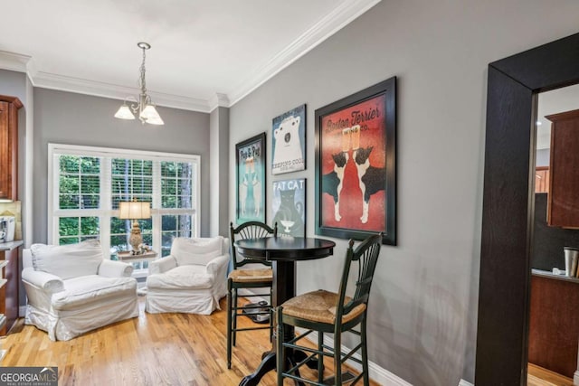 3150 Stonewyck Pl, Decatur, GA 30033 - dining room featuring ornamental molding, wood finished floors, and a chandelier