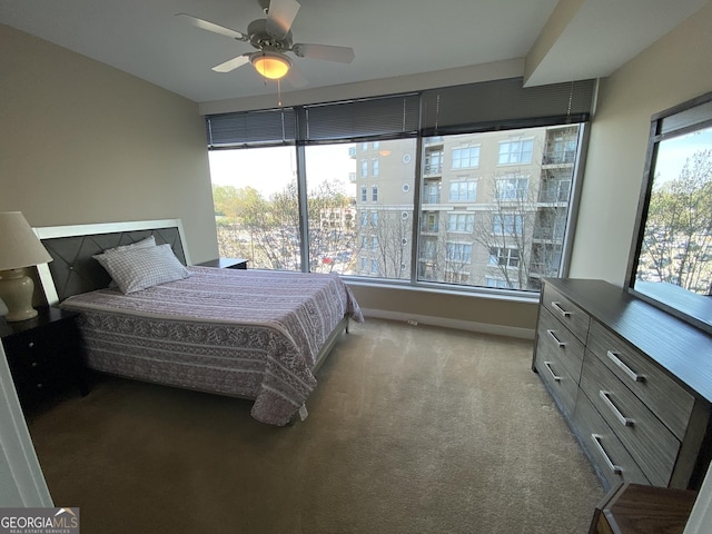 3338 Peachtree Rd NE Apt 505, Atlanta, GA 30326 - bedroom with carpet floors, baseboards, and ceiling fan