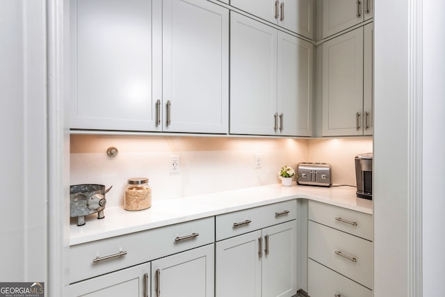 1013 Liberty Springs Dr, Woodstock, GA 30188 - kitchen featuring light countertops and gray cabinetry