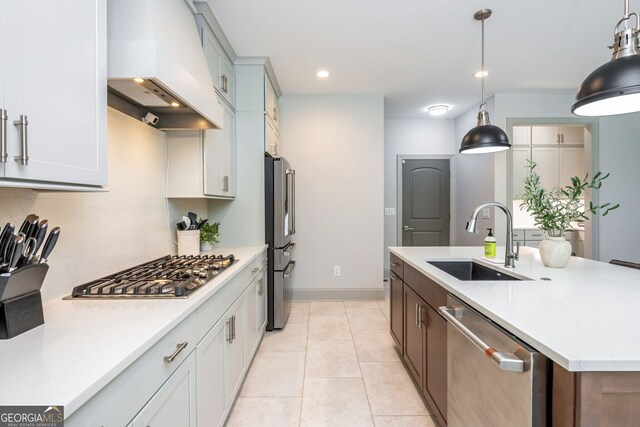1013 Liberty Springs Dr, Woodstock, GA 30188 - kitchen with appliances with stainless steel finishes, custom exhaust hood, a center island with sink, pendant lighting, and recessed lighting