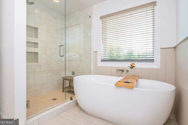 1013 Liberty Springs Dr, Woodstock, GA 30188 - full bathroom featuring a freestanding tub, a shower stall, and tile patterned flooring
