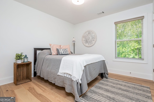 1013 Liberty Springs Dr, Woodstock, GA 30188 - bedroom with light wood finished floors and baseboards