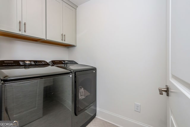 1013 Liberty Springs Dr, Woodstock, GA 30188 - laundry room featuring washer and dryer and cabinet space