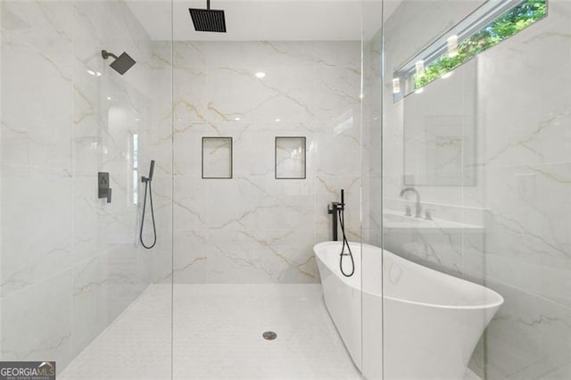 327 Ohm, Avondale Estates, GA 30002 - full bath featuring tile walls, a freestanding bath, and a marble finish shower