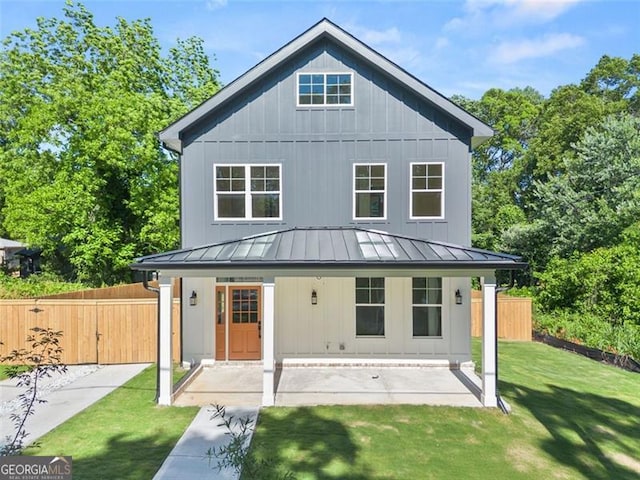 327 Ohm, Avondale Estates, GA 30002 - back of property featuring a standing seam roof, metal roof, and board and batten siding