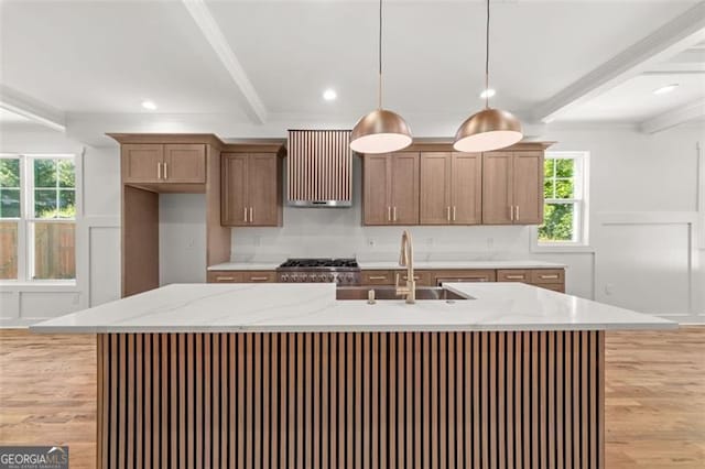 327 Ohm, Avondale Estates, GA 30002 - kitchen with beam ceiling, light wood finished floors, range hood, pendant lighting, and plenty of natural light