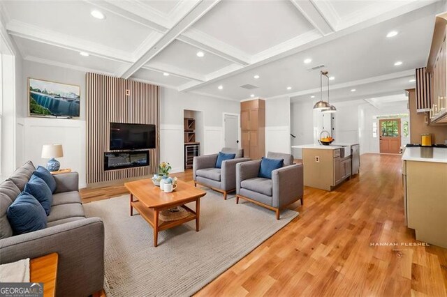 327 Ohm, Avondale Estates, GA 30002 - living room with coffered ceiling, light wood-style flooring, beam ceiling, recessed lighting, and a decorative wall