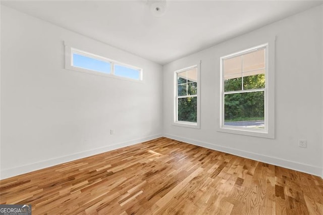 327 Ohm, Avondale Estates, GA 30002 - spare room featuring baseboards and light wood-style floors